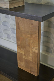 Ashley Furniture Camlett console sofa table with sleek wooden surface and tapered legs, ideal for entryways or living rooms.