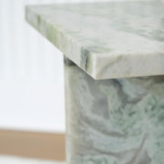 Ashley Furniture Deaconwell end table with a sleek wooden surface and modern design, perfect for living room decor.