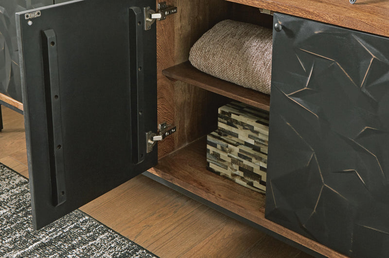 Ashley Furniture Dorannby accent cabinet with sleek wood finish and modern design, featuring doors and decorative hardware.