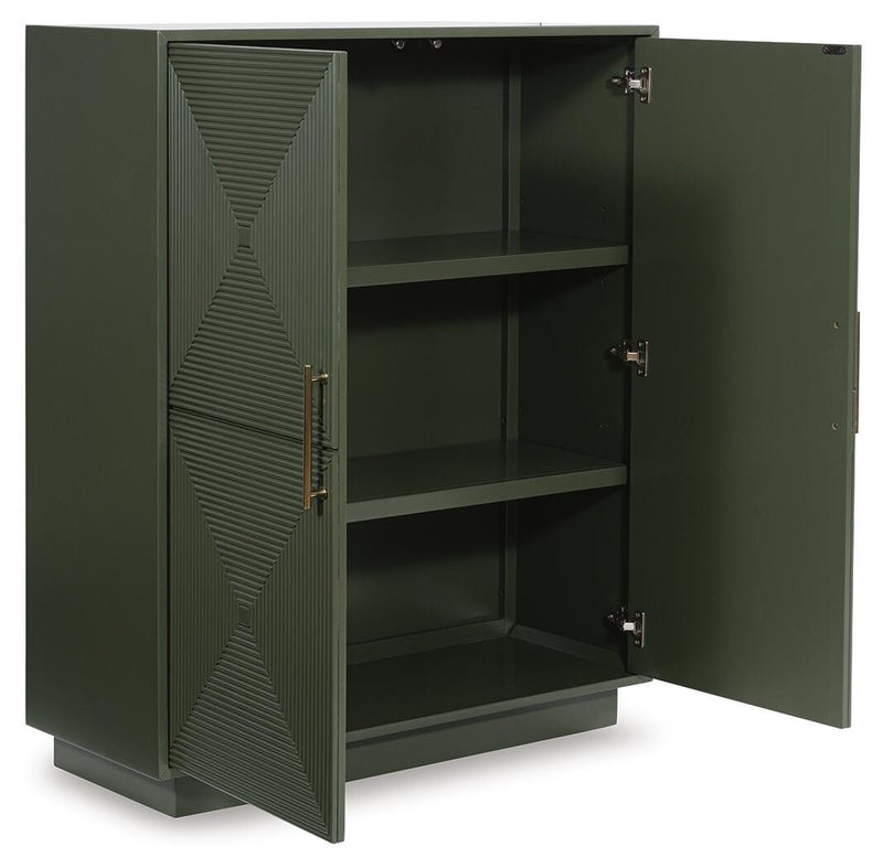 Open Ashley Furniture Geirwood Accent Cabinet showing wood finish, door panels, and interior shelves in a well-lit room.