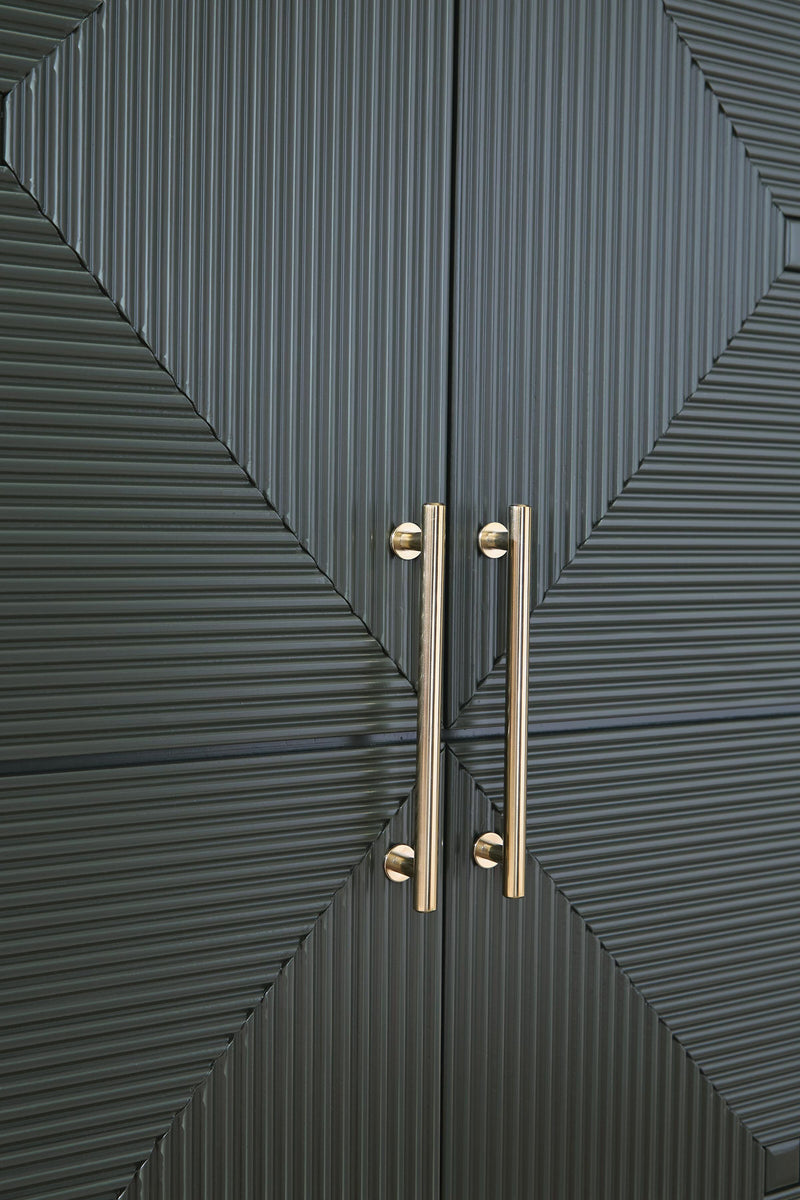 Close-up of Ashley Furniture Geirwood accent cabinet handle detail showing dark wood finish and elegant hardware.