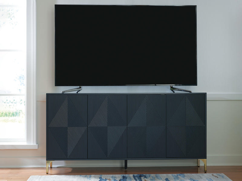 Ashley Furniture Loirwick Accent Cabinet with wood finish and decorative hardware, shown in a stylish living space.