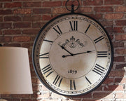 Ashley Furniture Augustina wall clock with a modern round design, featuring a sleek black frame and minimalist clock face.