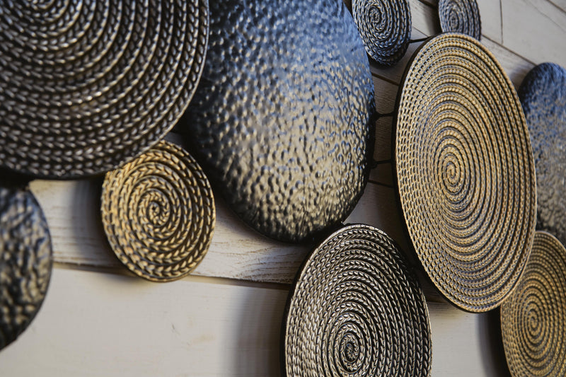 Detailed view of Ashley Furniture Emsley Wall Decor showcasing its stylish design and textured surface for home interior decoration.