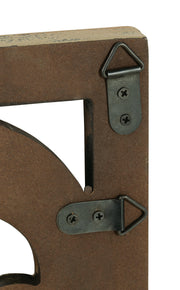 Ashley Furniture Candelario wall decor featuring elegant metal scrollwork and candle holders for stylish home decoration.