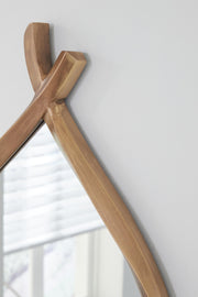 Ashley Furniture Bartner Accent Mirror showing a decorative framed mirror with intricate details and reflective surface.