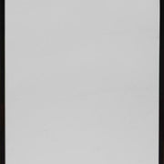 Ashley Furniture Bronick Floor Mirror, full-length mirror with a sleek frame, standing on a neutral background.