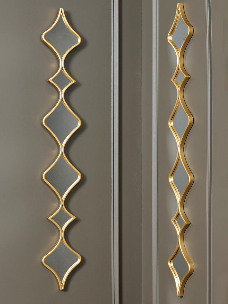 Set of two Ashley Furniture Harriswood accent mirrors with wooden frames, featuring rectangular and oval shapes for wall decor.