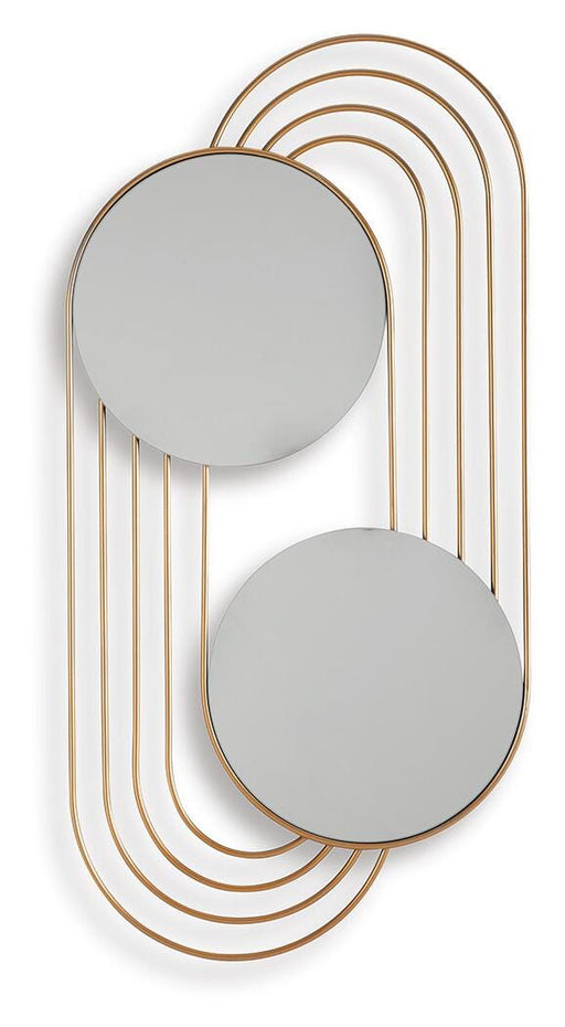 Ashley Furniture Warrenley accent mirror with a round, decorative frame, hanging on a wall in a well-lit room.