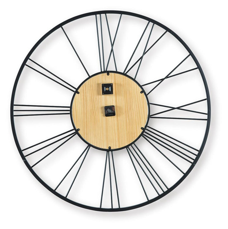 Ashley Furniture Brockett wall clock with a round face and modern design, mounted on a neutral wall.