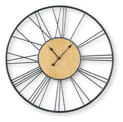 Ashley Furniture Brockett wall clock with a round wooden frame and classic design, hanging on a neutral-colored wall.