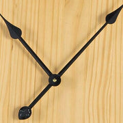 Ashley Furniture Brockett wall clock with a sleek round design and modern black frame, perfect for contemporary home decor.