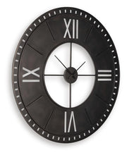 Ashley Furniture Lytle Wall Clock featuring a modern design with a round face and stylish frame, mounted on a wall.