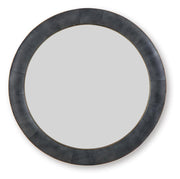Ashley Furniture Corinsworth Accent Mirror with a sleek frame, hanging on a wall in a modern living room setting.