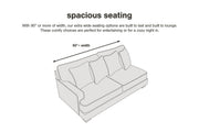 Ashley Furniture Boothbay Reclining Sofa showing plush fabric, multiple reclining seats, and comfortable design in a modern living room setting.