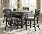 Ashley Furniture Tyler Creek counter height dining set with a table and matching chairs in a modern dining room setting.
