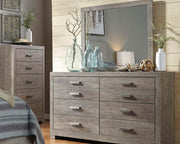 Ashley Furniture Culverbach dresser and mirror set with a sleek wooden finish and modern design, shown in a close-up image.