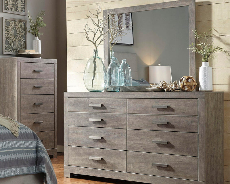 Ashley Furniture Culverbach dresser and mirror set with a sleek wooden finish and modern design, shown in a close-up image.