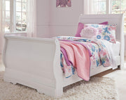 Ashley Furniture Anarasia Bed with a sleek wooden frame and elegant design, shown in a modern bedroom setting.