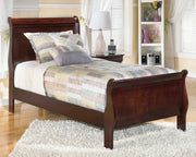 Alisdair Youth Bed by Ashley Furniture featuring a sturdy wooden frame with a natural finish and simple design.