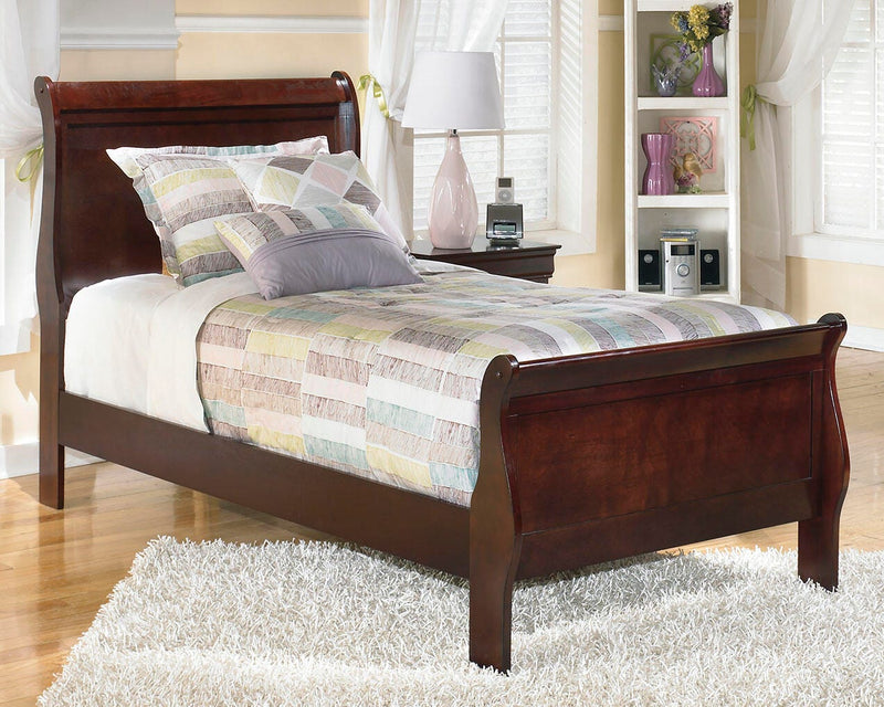 Alisdair Youth Bed by Ashley Furniture featuring a sturdy wooden frame with a natural finish and simple design.