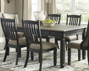 Ashley Furniture Tyler Creek dining room set with a wooden table and six matching chairs in a modern dining room setting.