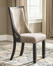 Ashley Furniture Tyler Creek dining room set featuring a wooden table and matching chairs in a classic design.