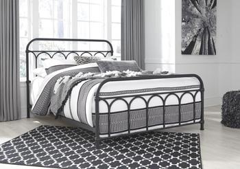 Ashley Furniture Nashburg Queen Bedroom Set mattress with matching bed frame and bedding in a modern bedroom setting.
