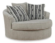 Ashley Furniture Calnita oversized swivel accent chair with plush upholstery and modern design, perfect for living room or lounge area.