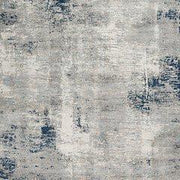 Ashley Furniture Wrenstow 7'10" x 10'3" rug featuring a textured, neutral-toned pattern perfect for living room or bedroom decor.