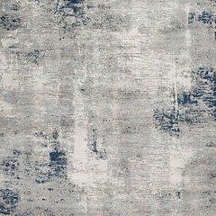 Ashley Furniture Wrenstow 7'10" x 10'3" rug featuring a textured, neutral-toned pattern perfect for living room or bedroom decor.