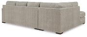 Ashley Furniture Calnita Living Room Set featuring a sofa and loveseat with plush cushions and modern design in a cozy living space.