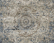 Ashley Furniture South 8x10 rug with intricate patterns and warm colors, shown on a wooden floor.
