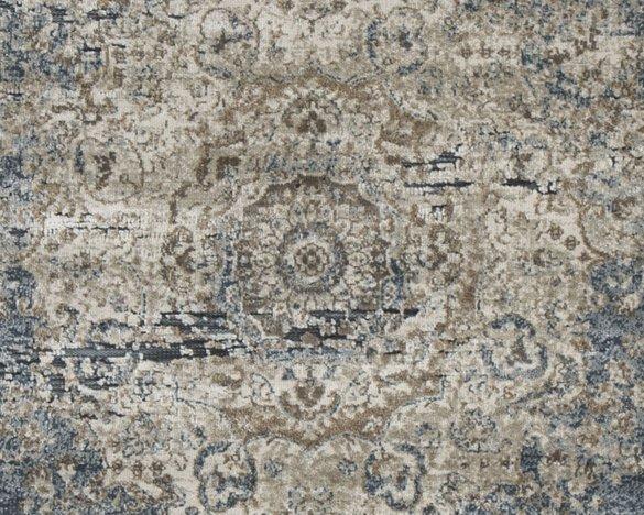 Ashley Furniture South 8x10 rug with intricate patterns and warm colors, shown on a wooden floor.