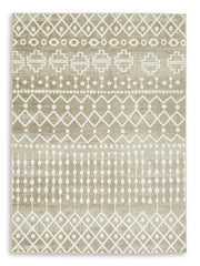 Medium washable rug by Ashley Furniture, measuring 4'11" x 7'2", with a soft, patterned surface suitable for living room or bedroom.