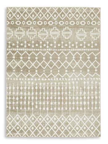 Medium washable rug by Ashley Furniture, measuring 4'11" x 7'2", with a soft, patterned surface suitable for living room or bedroom.