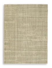 Ashley Furniture Janston Rug featuring a plush, patterned design in neutral tones, perfect for cozy living room decor.