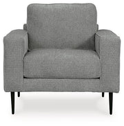 Ashley Hazela living room set featuring a sofa and loveseat with plush cushions and modern fabric upholstery in a cozy living space.