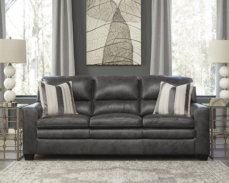 Ashley Furniture South 8x10 rug with intricate patterns in neutral tones, shown flat on the floor.