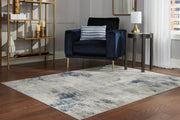 Ashley Furniture Wrenstow 7'10" x 10'3" rug showcasing a textured, neutral-toned design perfect for living room decor.
