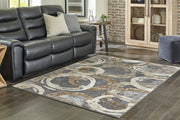 Ashley Furniture Faelyn 7'10" x 9'10" rug featuring a stylish pattern and soft texture, ideal for living room or bedroom decor.