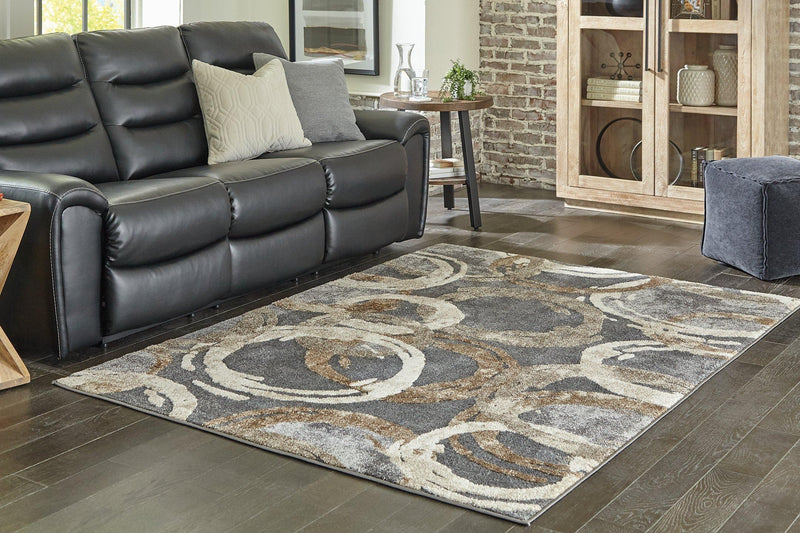 Ashley Furniture Faelyn 7'10" x 9'10" rug featuring a stylish pattern and soft texture, ideal for living room or bedroom decor.
