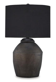 Naareman Ashley Furniture table lamp with a sleek base and fabric shade, placed on a modern side table in a stylish living room.