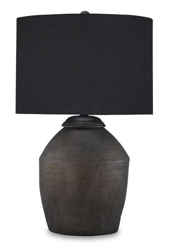 Naareman Ashley Furniture table lamp with a sleek base and fabric shade, placed on a modern side table in a stylish living room.