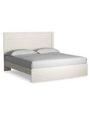 Ashley Furniture Stelsie bedroom set with a bed, nightstands, and dresser in a modern bedroom scene.