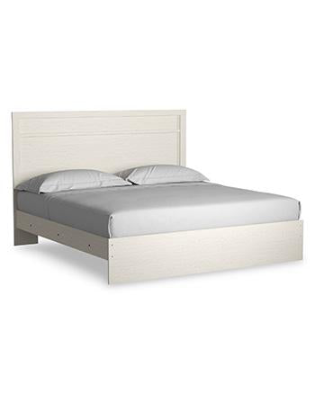 Ashley Furniture Stelsie bedroom set with a bed, nightstands, and dresser in a modern bedroom scene.