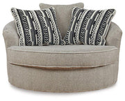 Ashley Furniture Calnita living room set featuring a sofa and matching chairs with neutral upholstery and modern design.
