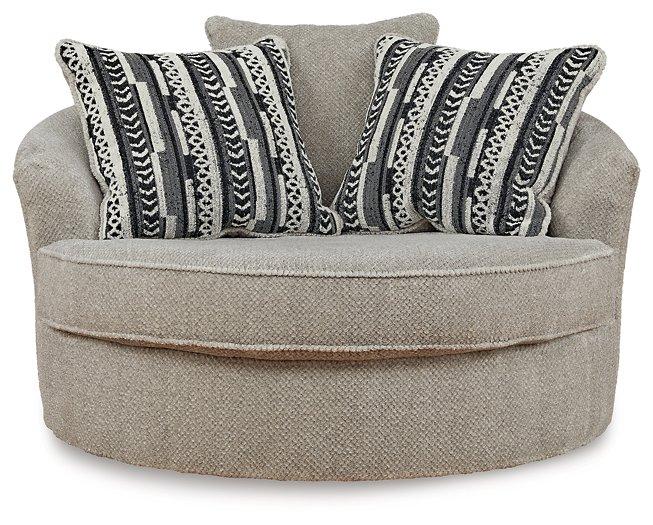 Ashley Furniture Calnita living room set featuring a sofa and matching chairs with neutral upholstery and modern design.