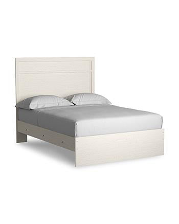 Ashley Furniture Stelsie bedroom set featuring a modern bed frame, matching nightstands, and dresser in a stylish bedroom arrangement.