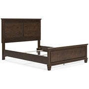 Ashley Furniture Danabrin Bed showing a modern wooden bed frame with a sleek headboard in a stylish bedroom setting.